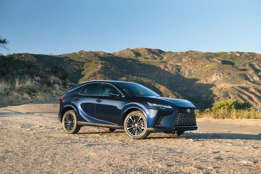 Blue 2023 Lexus RX 350 driving in the desert.