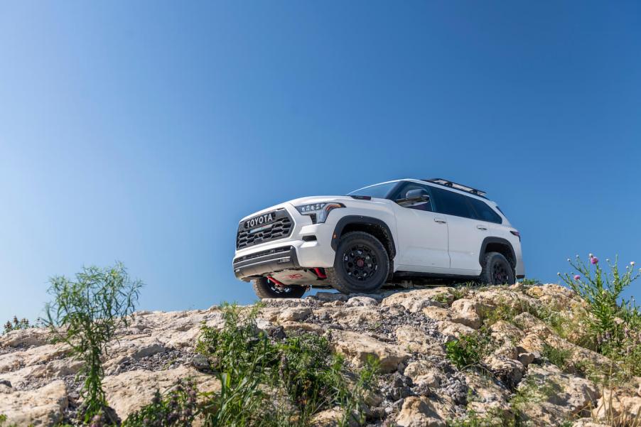 A white 2023 Toyota Sequoia TRD Pro on top of a rocky hill