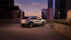 A 2024 Cadillac XT4 on display at dusk.