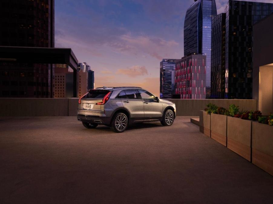 A 2024 Cadillac XT4 on display at dusk.