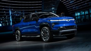 A blue 2024 Chevy Silverado EV on display