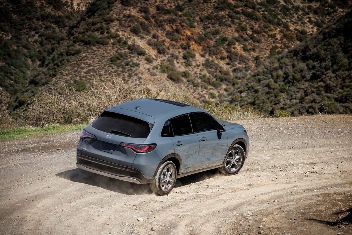 A gray 2024 Honda HR-V EX-L driving on a dirt road