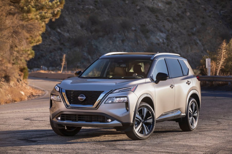 Silver 2023 Nissan Rogue parked at sunset.