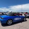 A blue Honda S2000 in the pit lanes