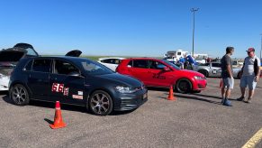 A couple of Volkswagen GTIs in the pits