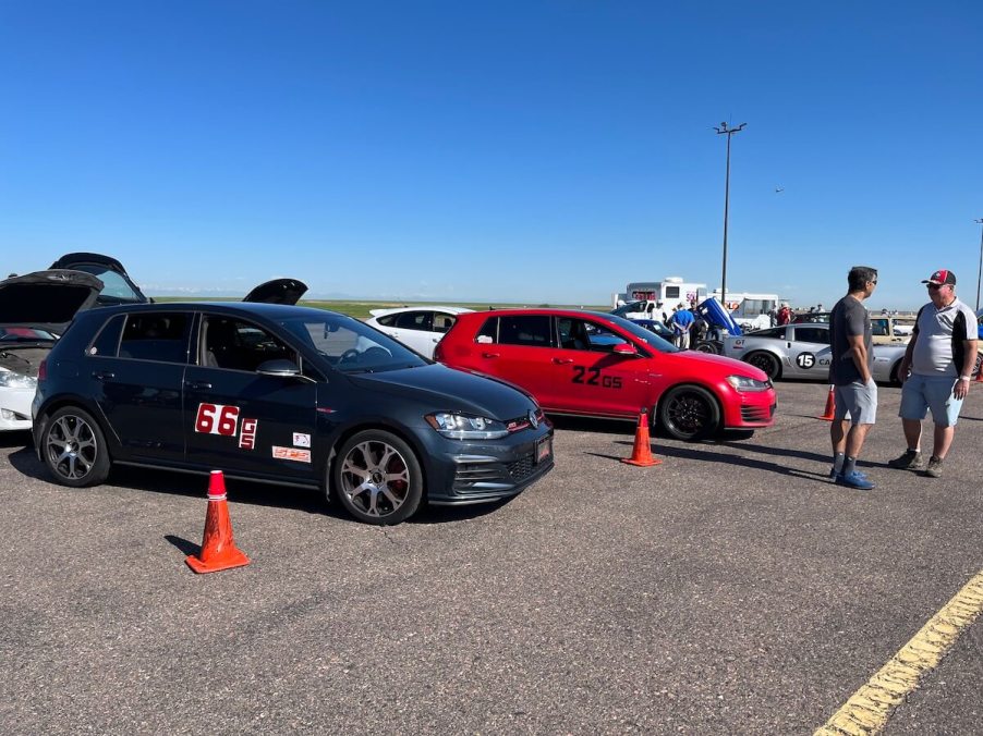 A couple of Volkswagen GTIs in the pits