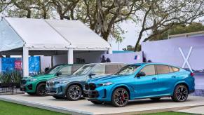 The world premiere of the (L to R) BMW X5, BMW X6, and BMW X5 M Competition on Amelia Island