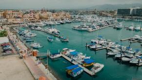 An arial shot on a busy marina with a lot of boats.