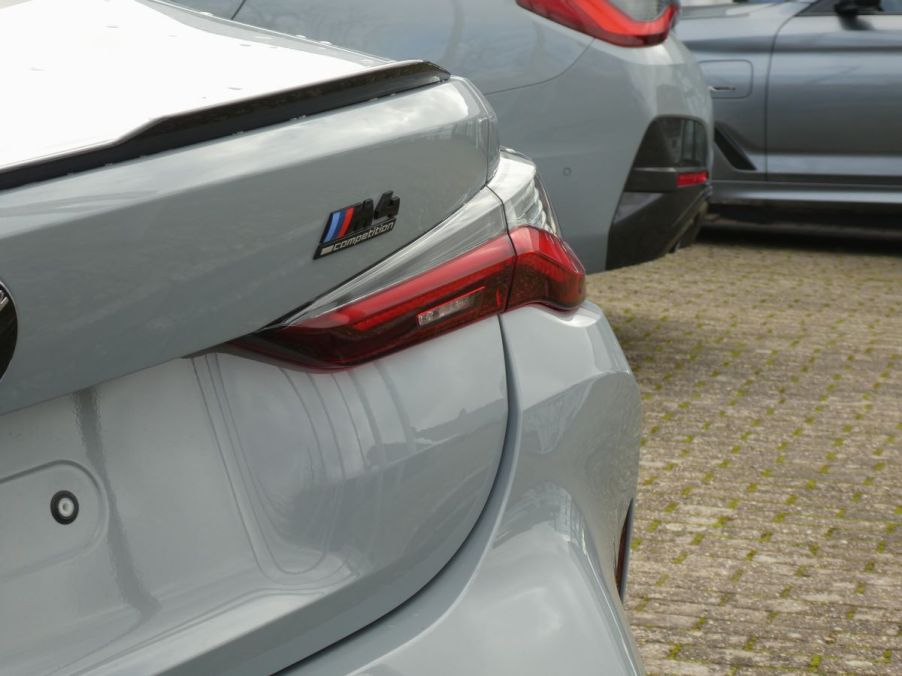 M4 Series Competition rear badging on a gray BMW 4 Series model in North Rhine-Westphalia, Cologne, Germany