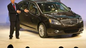 A Buick Verano being debuted at an auto show.