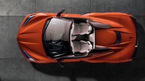 An orange Chevrolet Corvette shows off its drop-top.