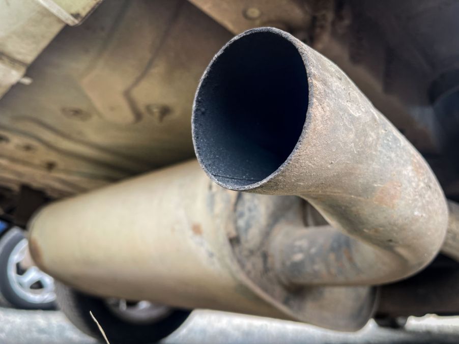 A car exhaust pipe without a silencer attached.