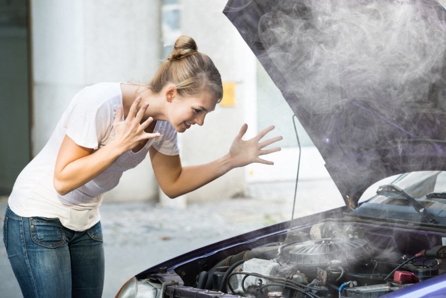 A smoking car due to overheating engine