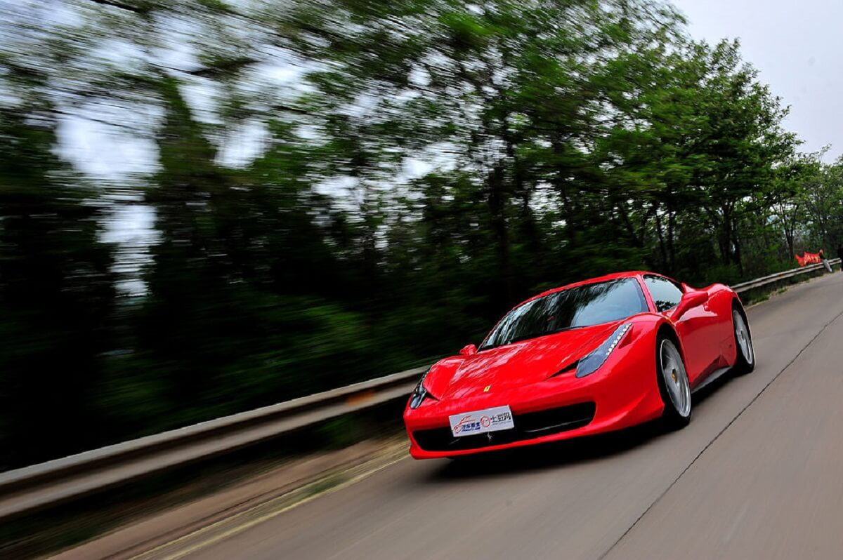 A bright red Ferrari 458 Italia shows off its bright red paintwork. 