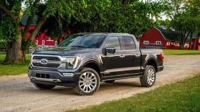 A gray Ford F-150 parks on a farm property.