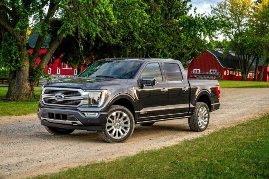 A gray Ford F-150 parks on a farm property.