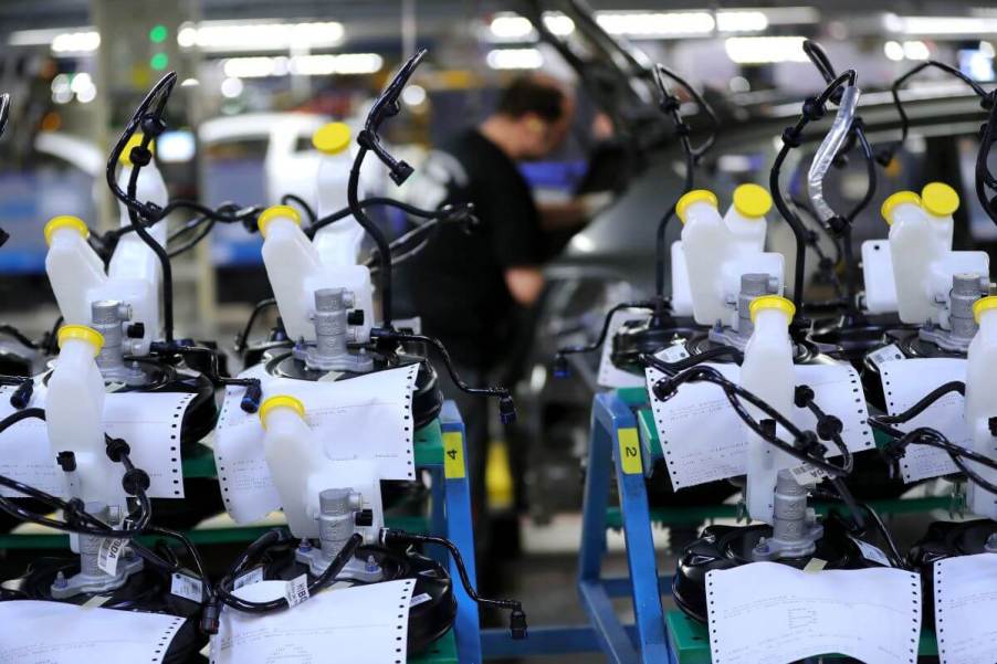 Motor vehicle brake vacuum servo components on a Ford Motor Company factory assembly line in Cologne, Germany