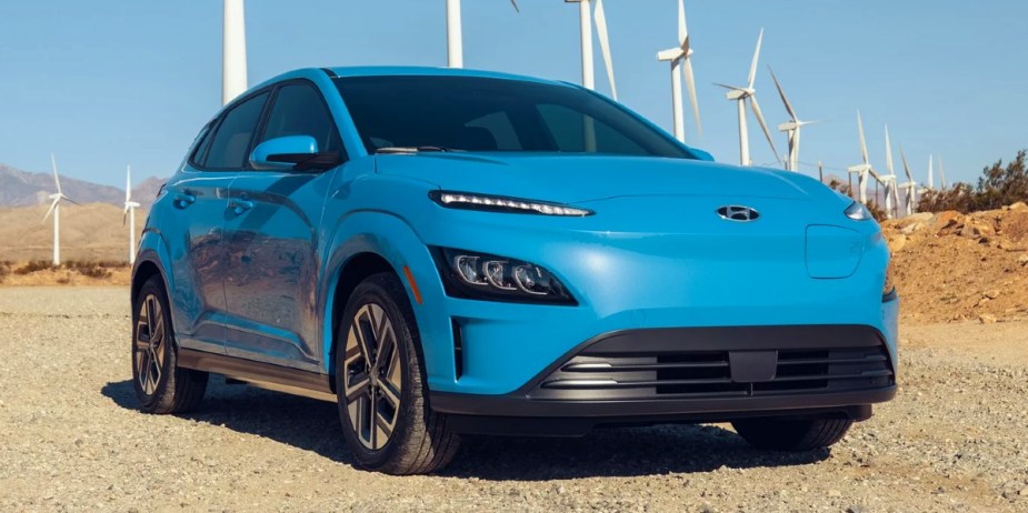 A blue 2023 Hyundai Kona Electric is parked. 