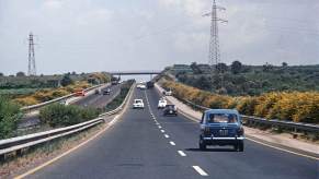 A driver blocking the left lane of an interstate highway.