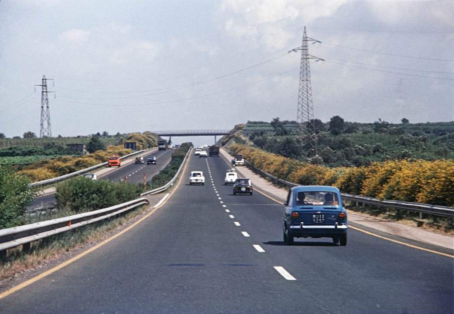 A driver blocking the left lane of an interstate highway.