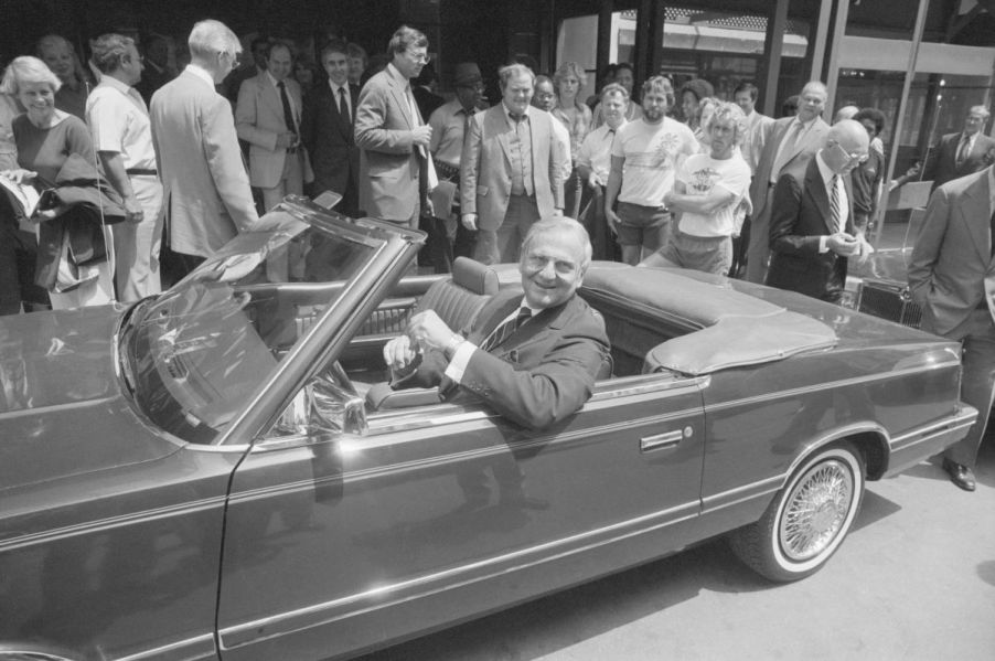 Chrysler Chairman Lee Iacocca sitting in the front seat of a 1982 1/2 Chrysler LeBaron Convertible prototype