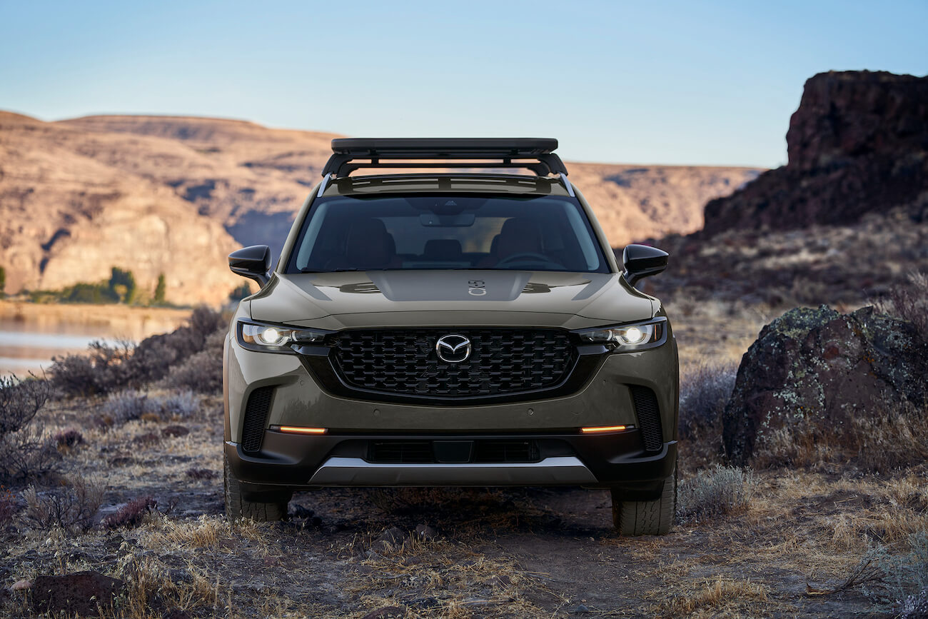 Zircon Sand 2023 Mazda CX-50 parked in the desert.