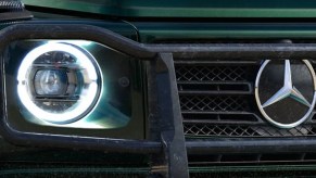 The front of a green Mercedes-Benz G-Class.