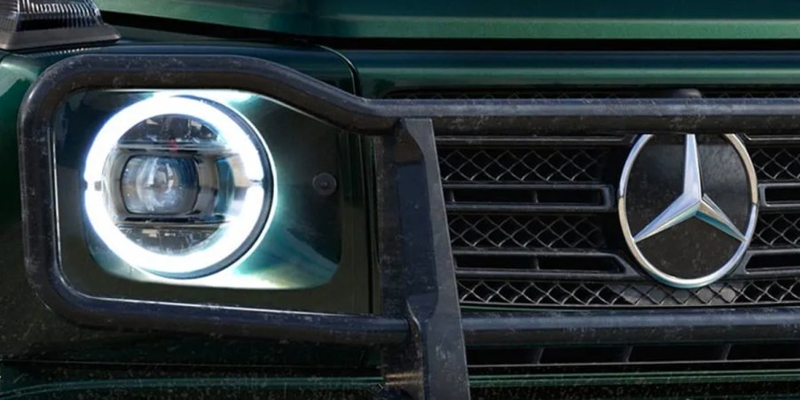 The front of a green Mercedes-Benz G-Class.