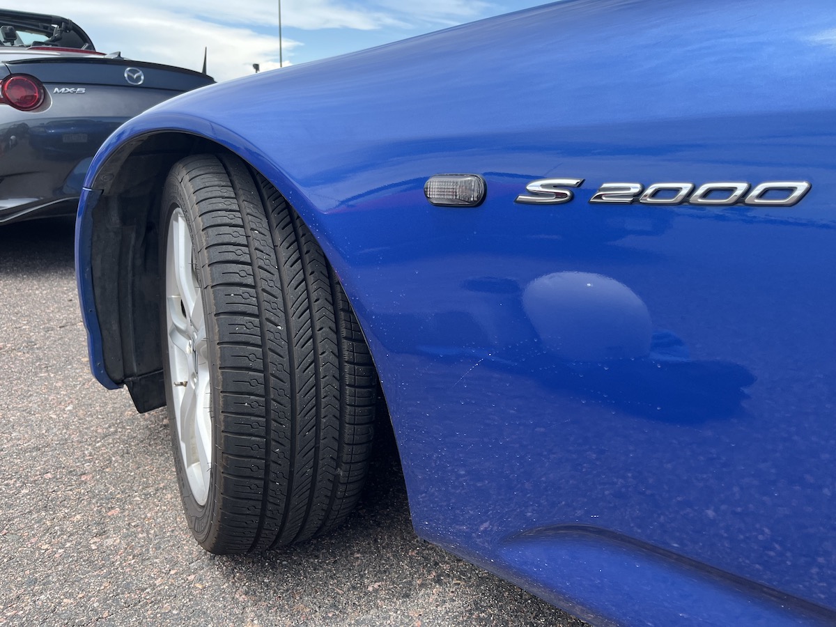 The Michelin Pilot Sport All Season 4 tires on a blue Honda S2000.