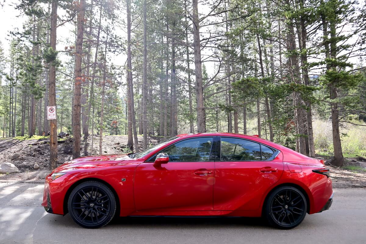 The Lexus IS 500 parked next to trees at RMDE 2023