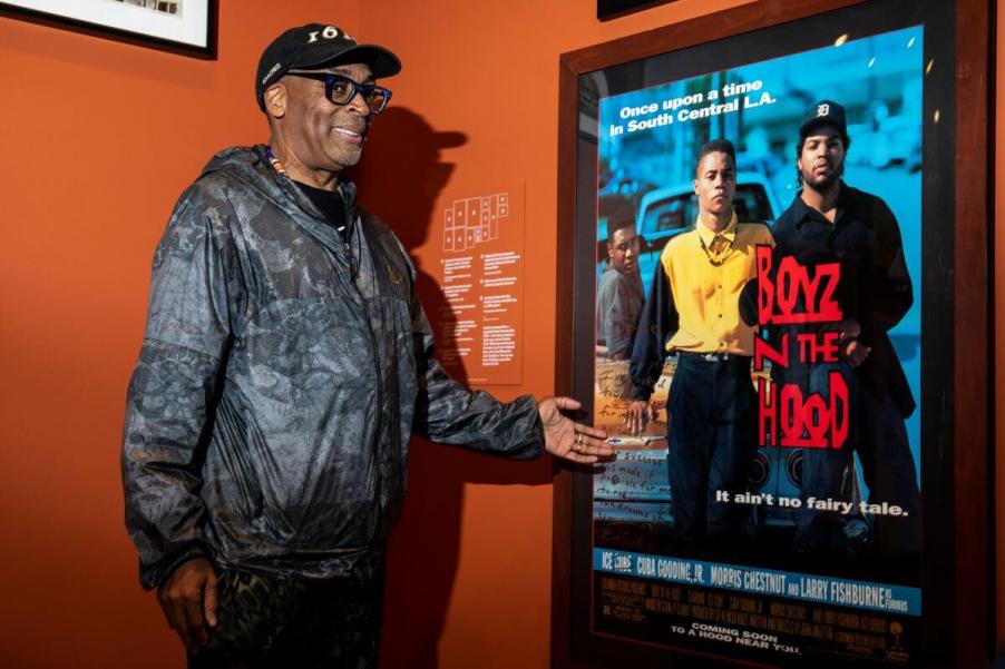 Spike Lee celebrating John Singleton with an original poster for 'Boyz N The Hood,' which popularized lowriders