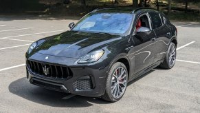 A black 2023 Maserati Grecale Modena is parked in a parking lot.