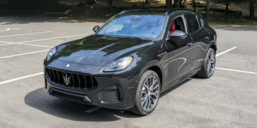 A black 2023 Maserati Grecale Modena is parked in a parking lot.