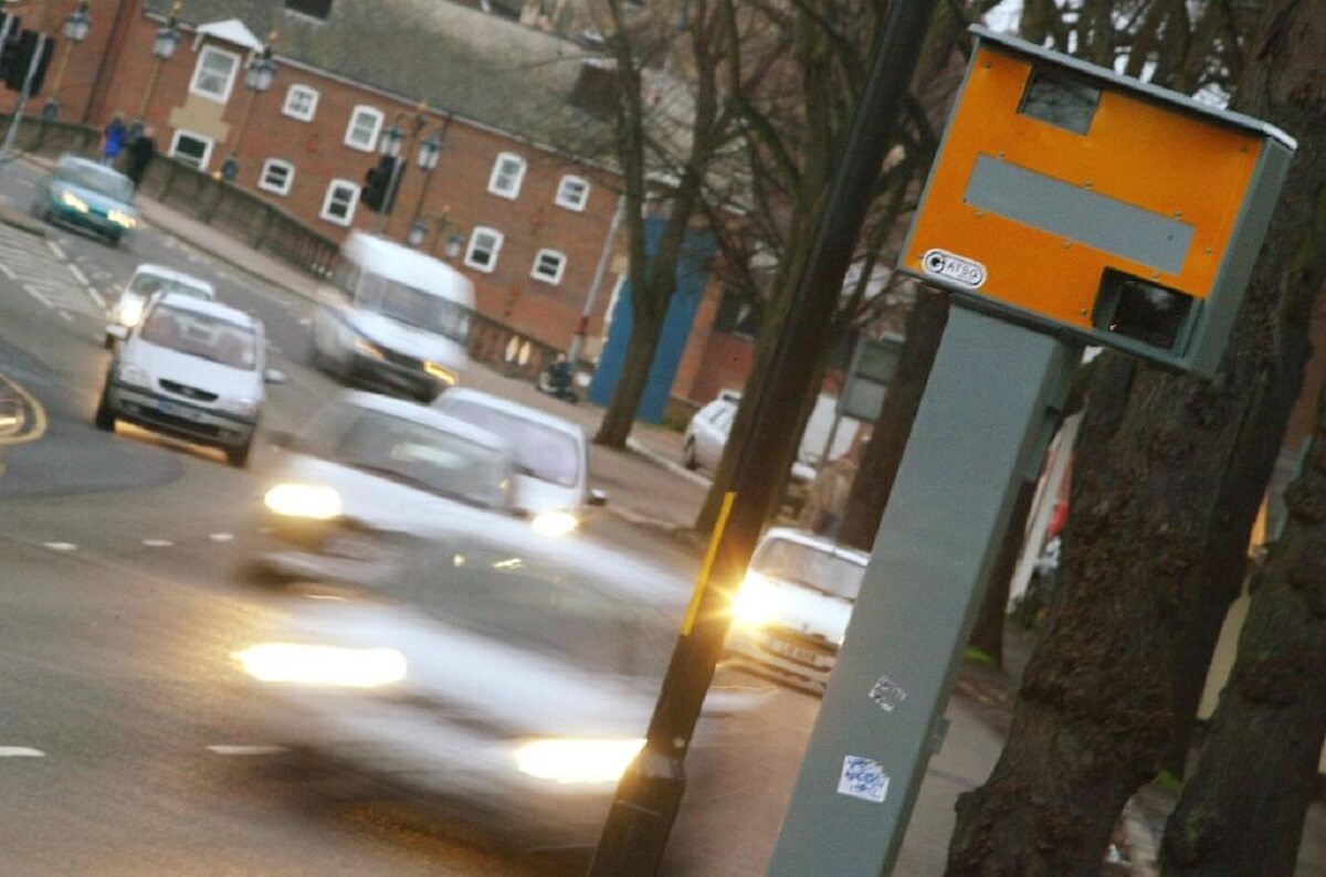 A speed camera enforces traffic and speeding laws in countries like the UK and Switzerland. 