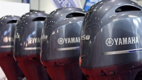 Yamaha outboard motors are displayed during the London Boat Show.