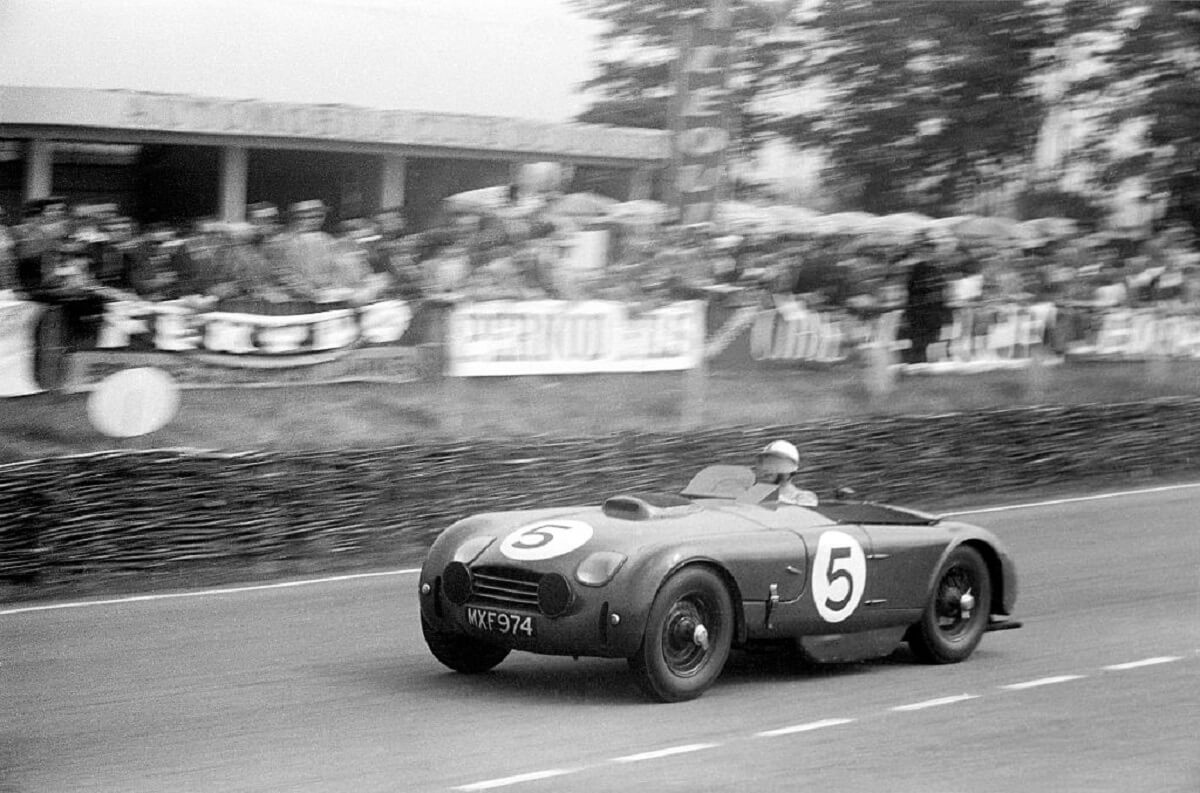 Zora Arkus-Duntov drives a Porsche in a Le Mans race. 