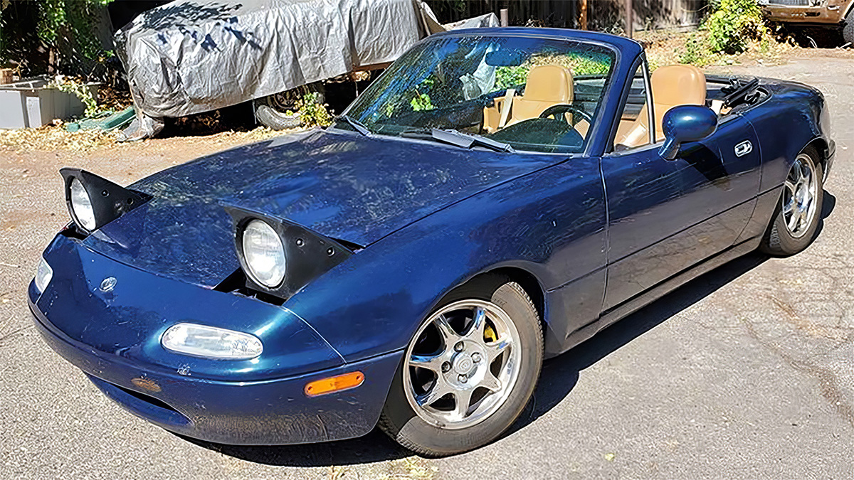 Montego Blue Mica 1994 Mazda Miata M Edition Front 3/4 parked in the sun