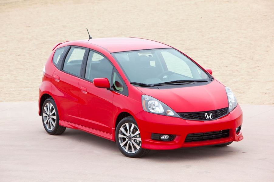 A 2013 Honda Fit Sport hatchback model in red