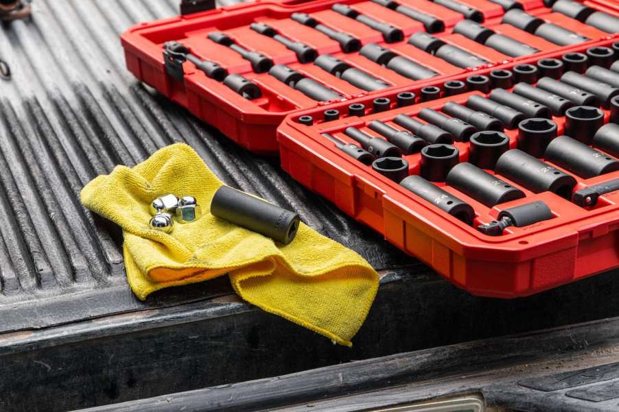 A set of tools on the bed of a reliable 2023 Ford F-150 pickup truck