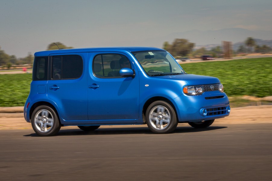 The 2014 Nissan Cube driving down the road