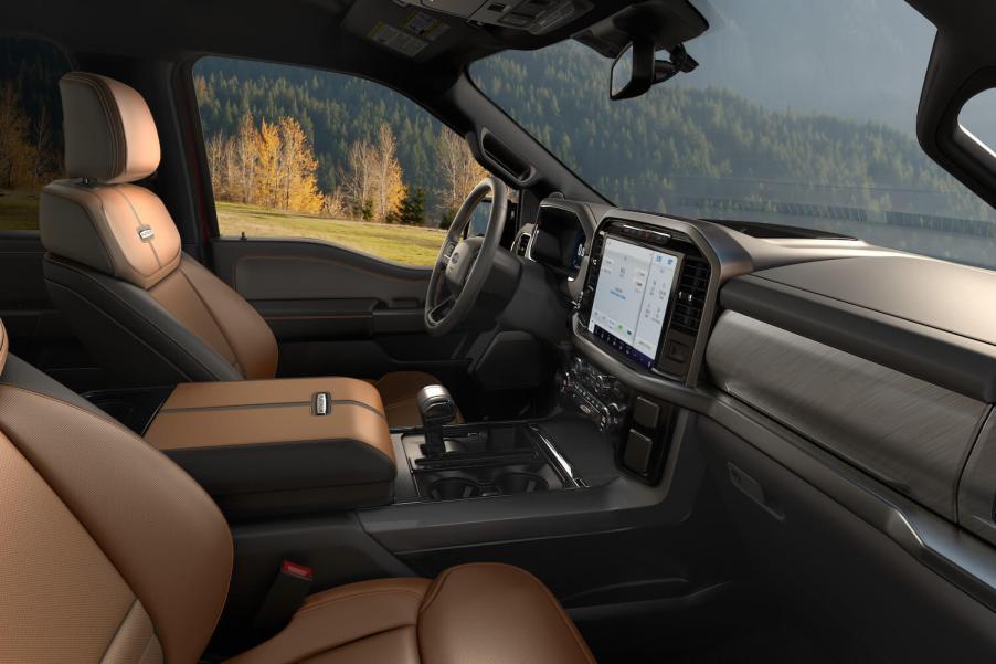 The brown leather interior of a Ford F-150 King Ranch pickup truck with its 10-speed automatic transmission shift lever visible.