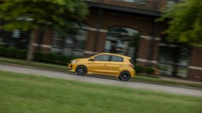 A 2021 Mitsubishi Mirage drives on city streets.