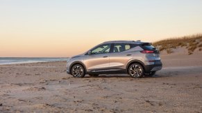 A Chevrolet Bolt EUV parks on the sand.