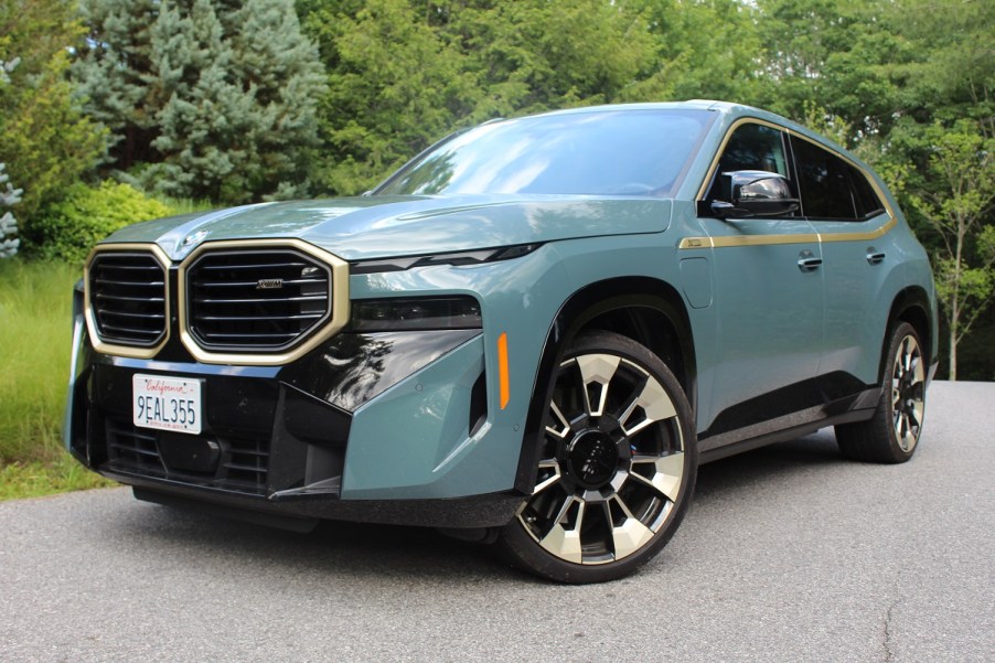 The 2023 BMW XM parked by foliage