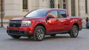 A red 2023 Ford Maverick parked in the city