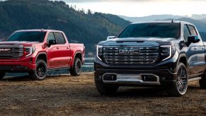 2 2023 GMC Sierra 1500 trucks parked next to each other.