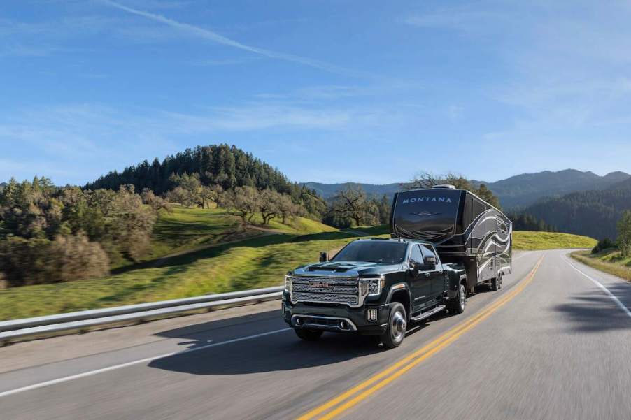 A 2023 GMC Sierra 3500HD towing a large travel trailer