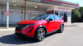 A front view of the 2023 Nissan Ariya at an abandon gas station