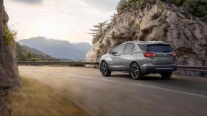 A 2023 Chevrolet Equinox driving away on an open highway.