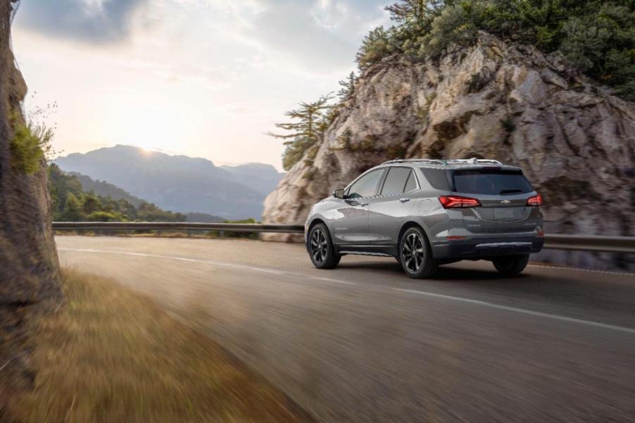 A 2023 Chevrolet Equinox driving away on an open highway.